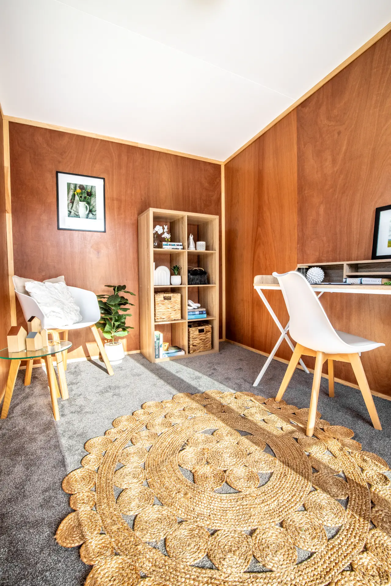 Outaspace Office OutaSpace cabin fitted out as an office, with desk, chairs and a round rug